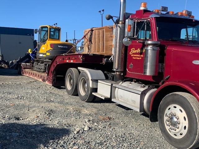 Bertram Excavating lowbed truck hauling equipment